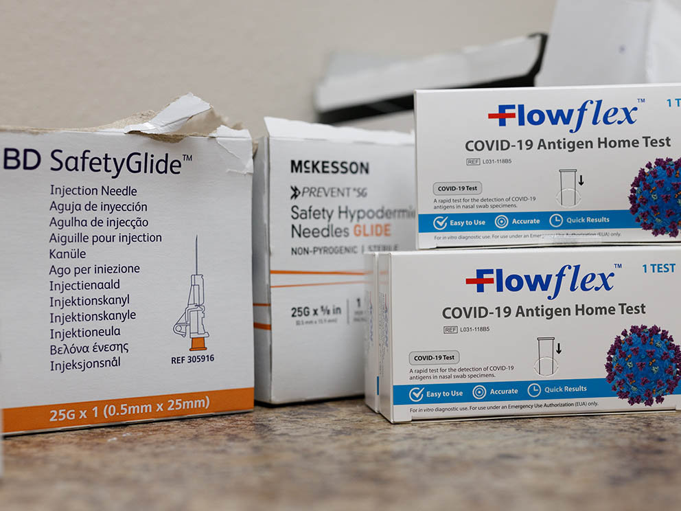 Photo of boxed needles and test kits.